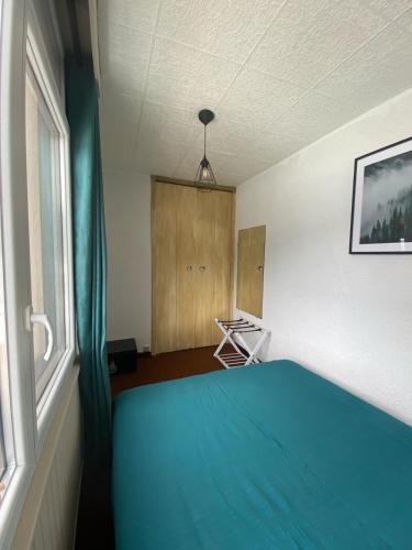 Katil atau katil-katil dalam bilik di Appartement 50m2 vue imprenable avec garage draps et serviettes compris
