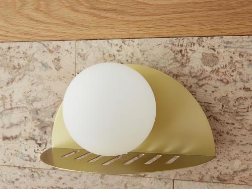 a white orb sitting on a gold shelf at Green Valley Hotel in Mount Pritchard