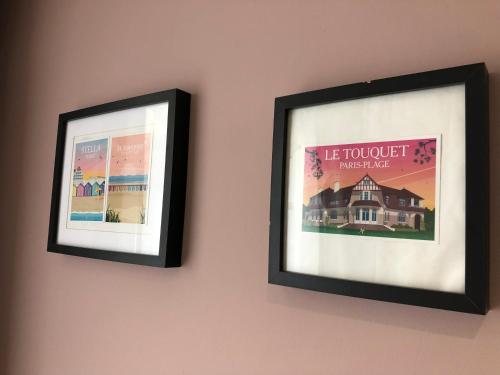 two framed pictures hanging on a wall at Hotel Les Embruns in Le Touquet-Paris-Plage
