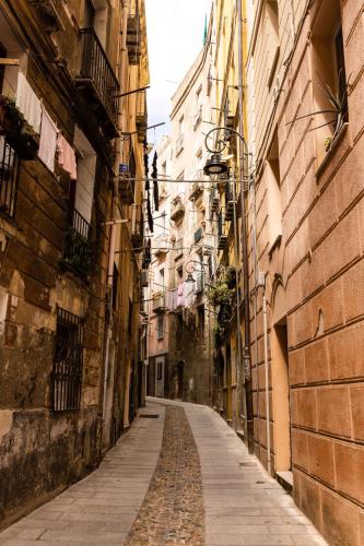an empty alley way between two buildings at Soul Valley all-in boutique hotel with yoga & wellness in Maracalagonis