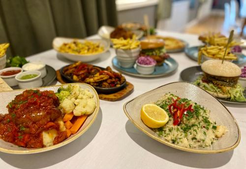 a table with plates of food on a table at Lion Hotel in Worksop