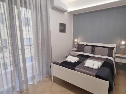 a bedroom with a large bed with two pillows on it at B&B Estia Domus in Pompei
