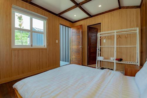 Postel nebo postele na pokoji v ubytování Mơ Home Đà Lạt