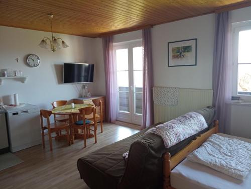 a living room with a couch and a table at Urlaub am Glatzl Bauernhof in Sankt Lorenzen am Wechsel