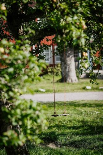 two poles in the grass in a park at Ödevata Gårdshotell in Emmaboda