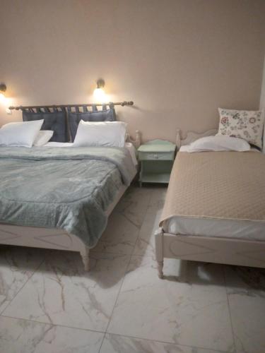 Ένα ή περισσότερα κρεβάτια σε δωμάτιο στο Maria Apartments