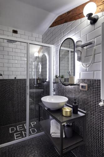 a bathroom with a sink and a shower at UNAHOTELS Ala Venezia-Adults 16 in Venice