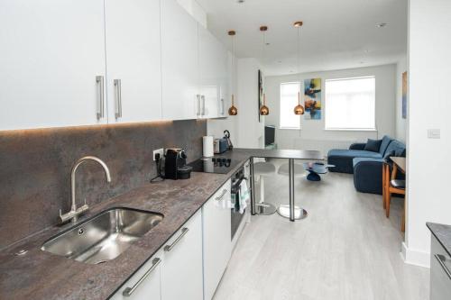 a kitchen with a sink and a counter top at 1 Bedroom flat in Barons Court in London