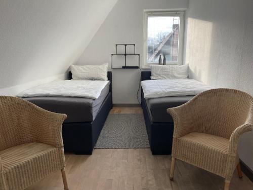 Ліжко або ліжка в номері Caros Zimmer Gladbeck