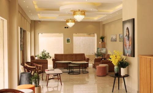 a lobby with a waiting room with chairs and tables at Hotel Samye - Best Hotel In Thimphu in Thimphu