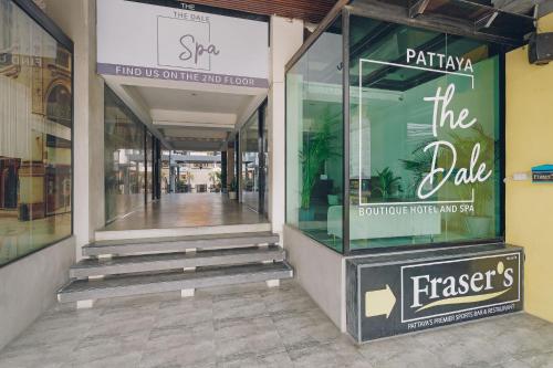 a store front with glass doors and stairs in a mall at Chateau Dale Boutique Resort Spa Villas in Pattaya South