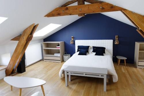 Llit o llits en una habitació de Maison Baptistine