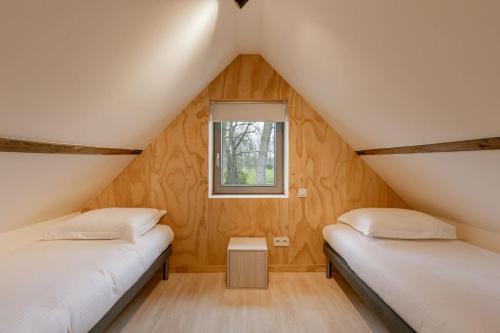 Ліжко або ліжка в номері Charming ecologic holiday home in Damme
