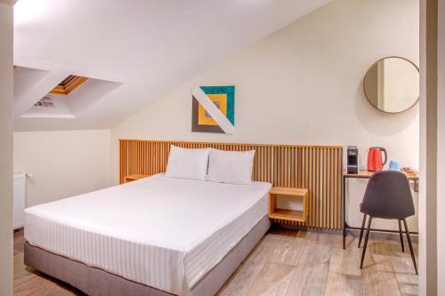 Un pat sau paturi într-o cameră la Hotel Forty One