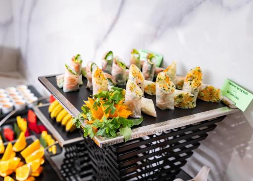 a bunch of food on a tray on a table at L'Signature Hotel & Spa in Hanoi
