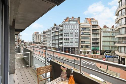 a balcony with a table and some buildings at Huswell - Enjoyable studio in the center of Knokke in Knokke-Heist