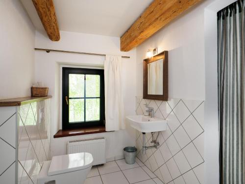 a white bathroom with a sink and a toilet at Płonica 1 in Złoty Stok