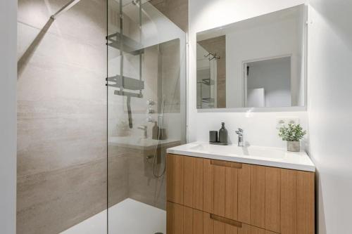 a bathroom with a sink and a shower at Centrally located apartment in Middelkerke in Middelkerke