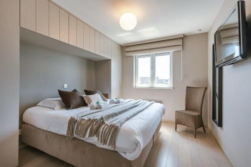 Postel nebo postele na pokoji v ubytování Huswell - Bright apartment with parking near the beach