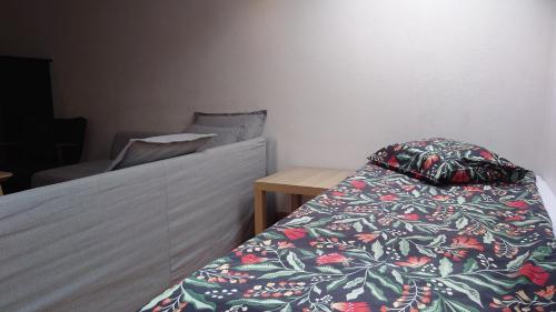 a bedroom with a bed with a pillow on it at Apartamenty przy STONEHENGE in Sosnowiec