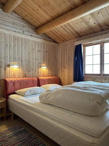 Säng eller sängar i ett rum på Nostalgi i Stakkstøli