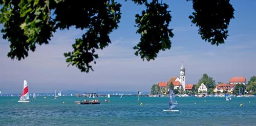 a large body of water with boats in it at Ferienhaus Moos in Wasserburg am Bodensee