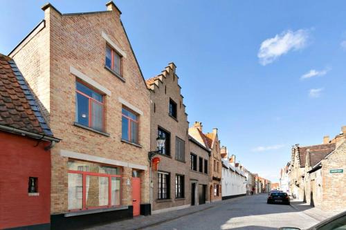 an alley in an old town with brick buildings at Huswell - Charming town house in historic center of Bruges in Bruges