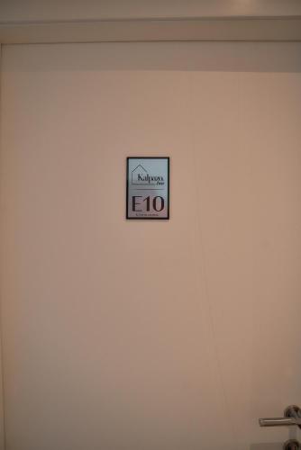 a sign on the wall of a room at Kalpazo Inn Tirana in Tirana