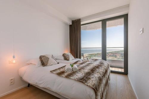 Postel nebo postele na pokoji v ubytování Beautiful new apartment with a stunning view