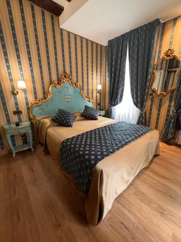Posteľ alebo postele v izbe v ubytovaní Hotel al Graspo de Ua