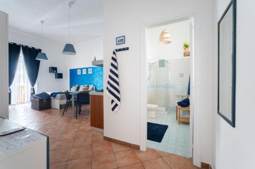 a room with a kitchen and a living room at Casa Norma in Lipari
