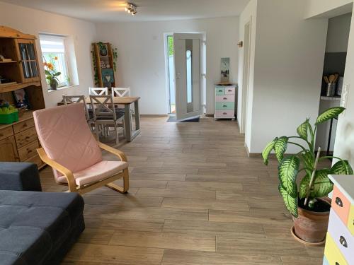 a living room with a couch and a table at Am Sonnenhang in Hilzingen