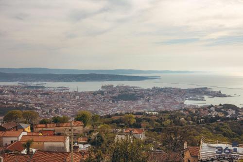 a view of a city and a body of water at Trieste 10min dal Centro Villa Privata con Jacuzzi in Trieste