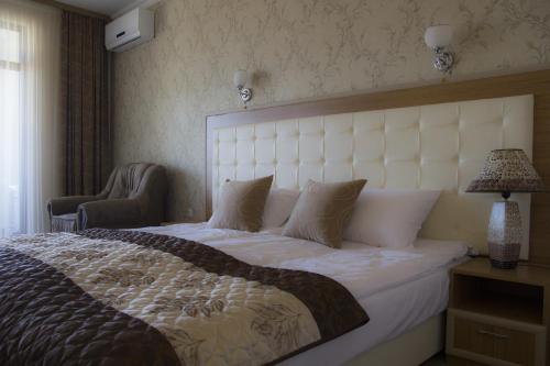 Кровать или кровати в номере Hotel Paradise