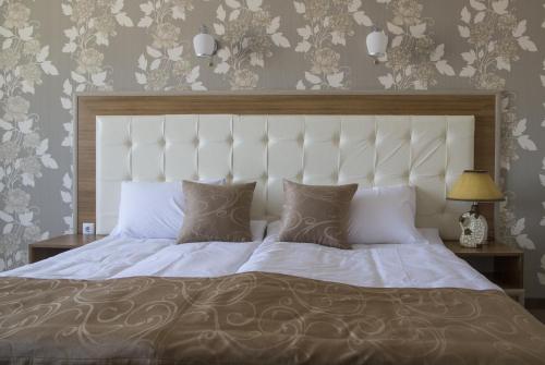 Кровать или кровати в номере Hotel Paradise