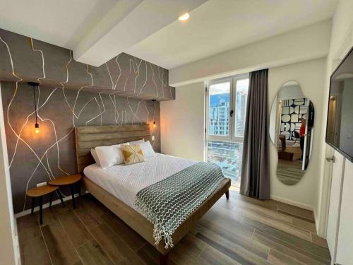 Tempat tidur dalam kamar di Ua ua - Comfortable apartment