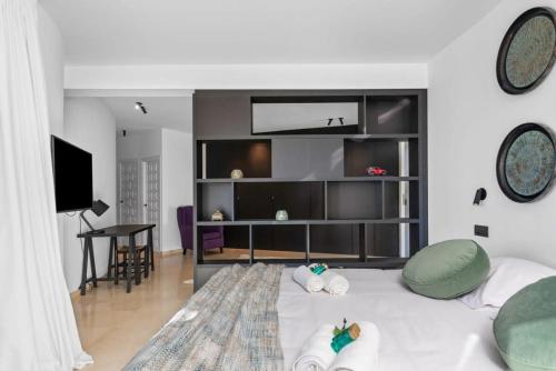 a bedroom with a large bed with pillows on it at Huswell - Relax in luxury at this stunning seaside Villa in Calpe