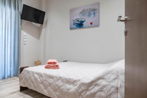 Postel nebo postele na pokoji v ubytování Niotis House - Elegance & comfort in the city