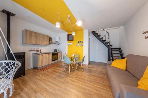a kitchen and living room with a couch and a table at Casa Argo Guest House in Bisaccia