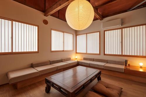 a living room with a couch and a table at anchorAsakusa Vacation Rental in Tokyo