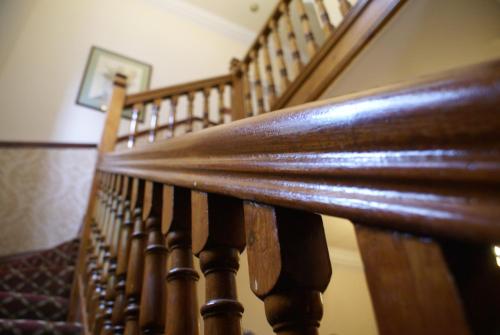 a close up of a wooden stairway at Haley's Hotel in Leeds