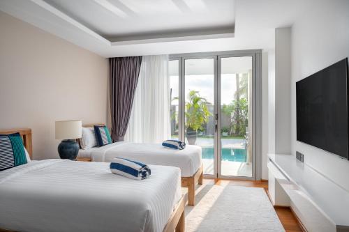 Katil atau katil-katil dalam bilik di Beachfront Residences - Stunning Sea and Lake View