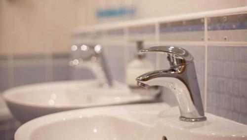 a sink with a faucet in a bathroom at Relax Vila se zahradním wellness in Ostrava