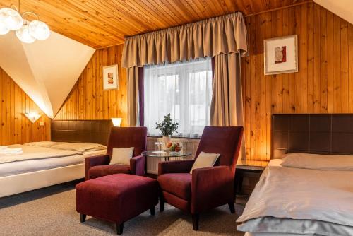 Postel nebo postele na pokoji v ubytování Hotel Schwarz