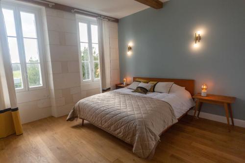 Ένα ή περισσότερα κρεβάτια σε δωμάτιο στο chateau haut gouat