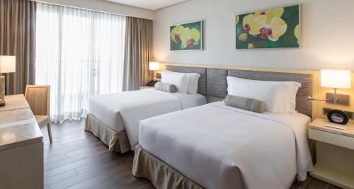 Cama o camas de una habitación en Dusit Thani Mactan Cebu Resort