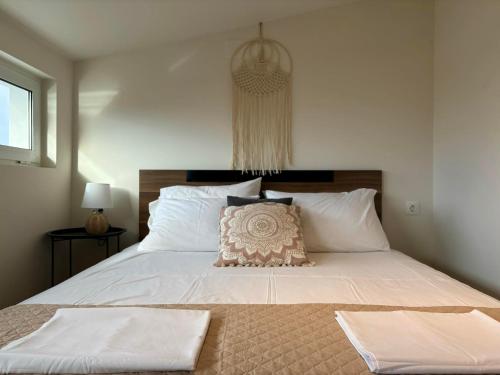 Ένα ή περισσότερα κρεβάτια σε δωμάτιο στο Maya Suites N.Moudania