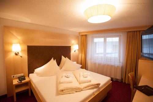 Postel nebo postele na pokoji v ubytování Hotel Albona
