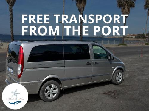 a van parked in a parking lot with the words free transport from the port at Stella di Mare in Civitavecchia