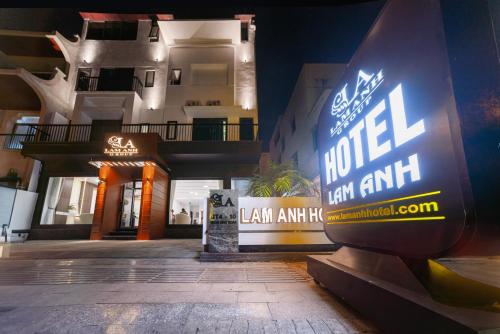 a hotel sign in front of a building at night at Lam Anh Hotel Bắc Từ Liêm Hà Nội in Hanoi